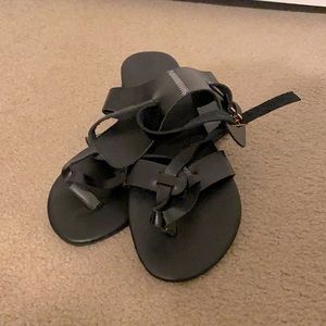 Black sandals size 36 but Can fit a size 37 as well